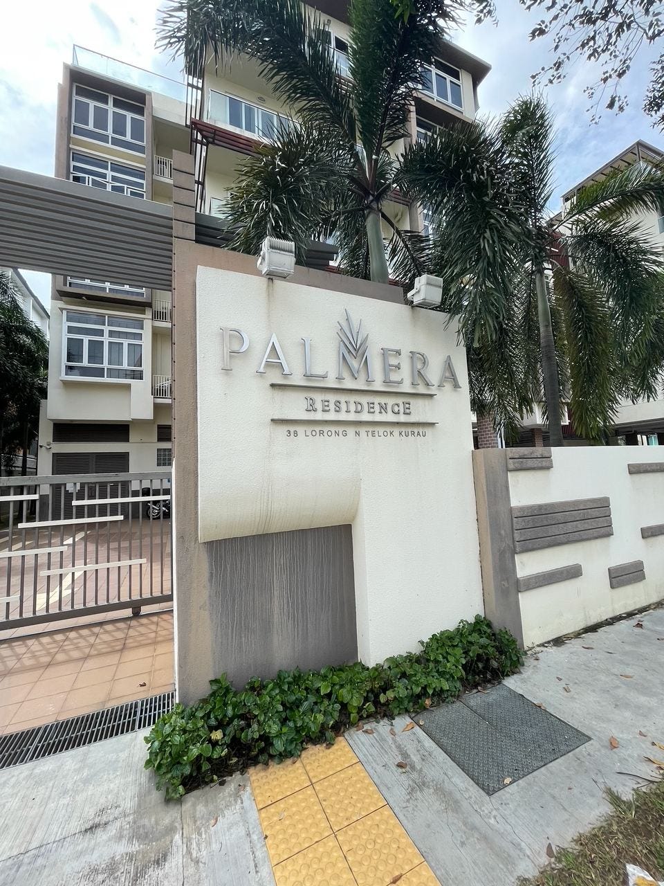 Entrance sign for Palmera Residence
