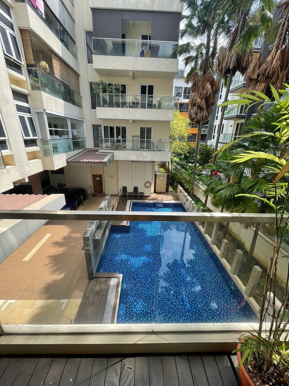 View of the Palmera Residence pool from an upper walkway