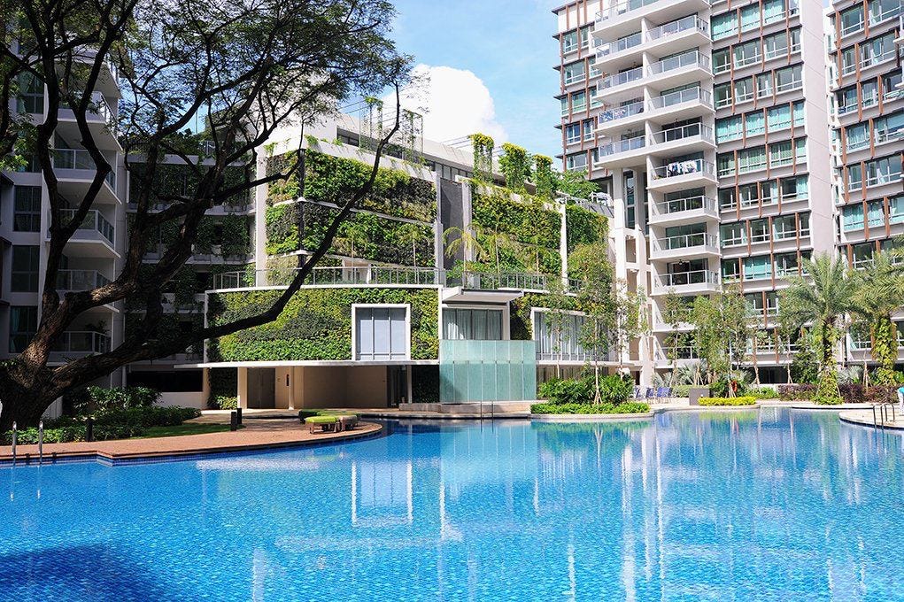 Condominium swimming pool surrounded by apartment buildings