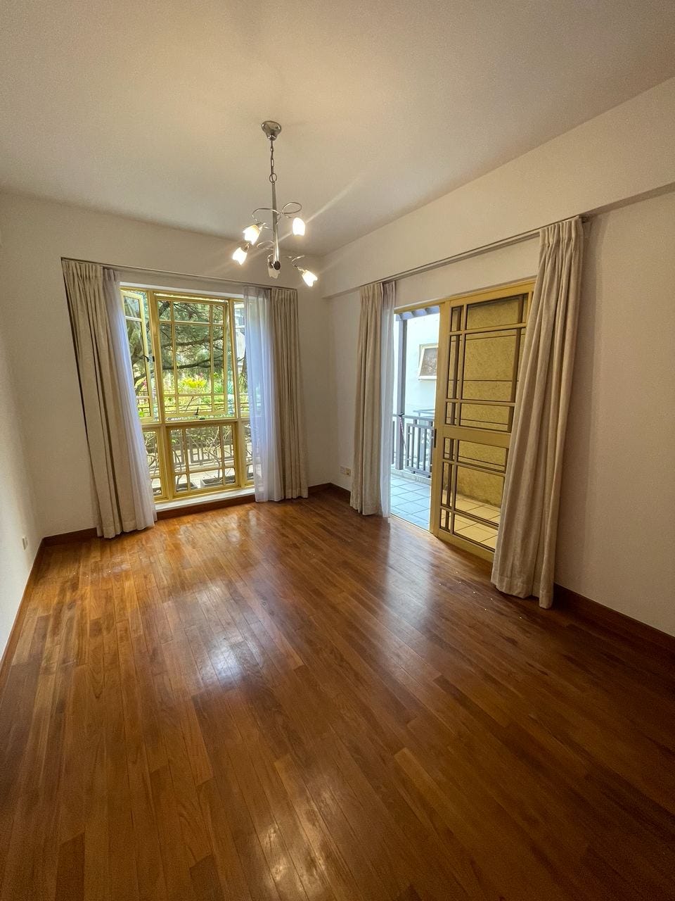 Wood-floored bedroom in the viewed apartment
