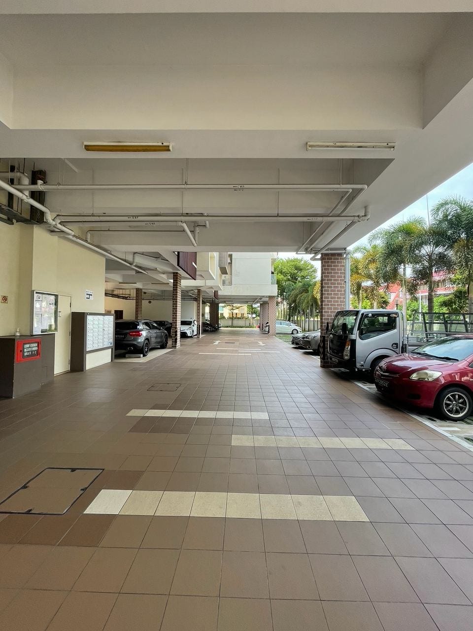 Ground-level parking area at Palmera Residence