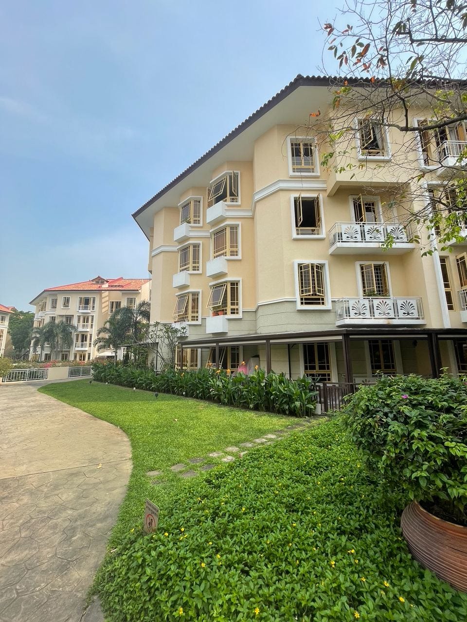 Low-rise Villa Marina building beside a lawn