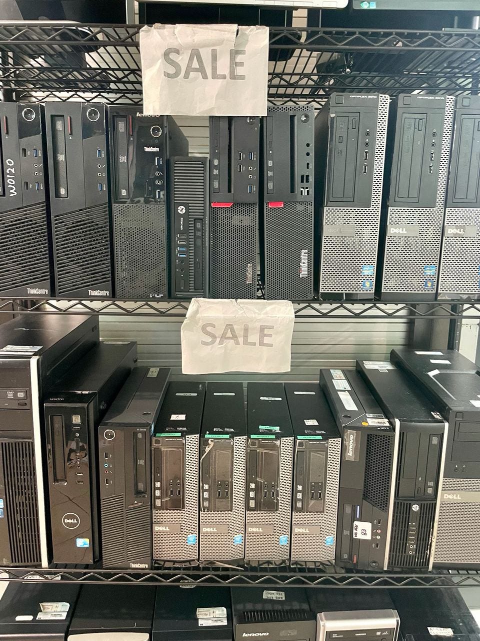 Rows of used desktop computers for sale