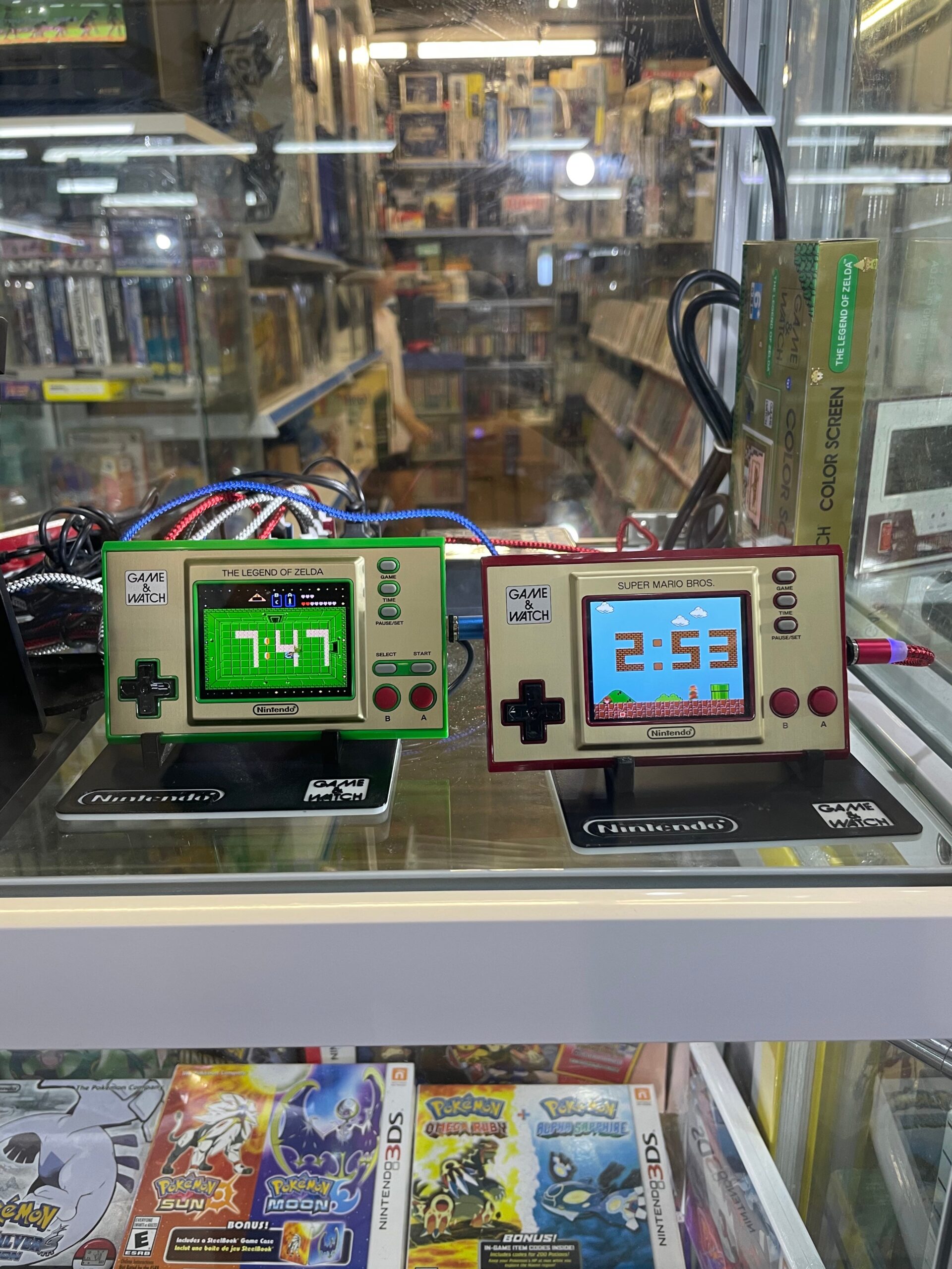Retro digital clocks and games in a display case