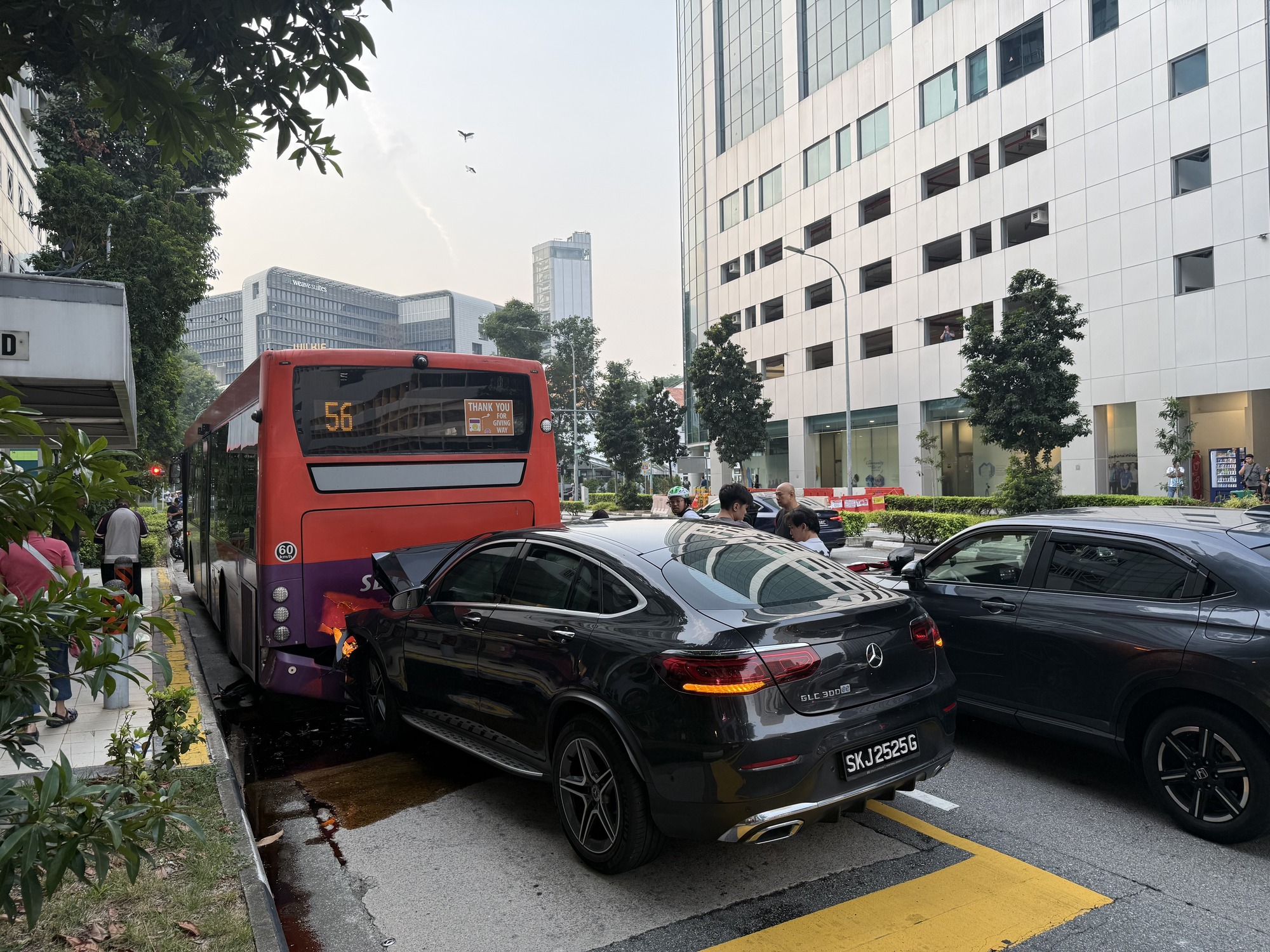 Rear of a Mercedes with registration SKJ2525G after a collision with a bus.