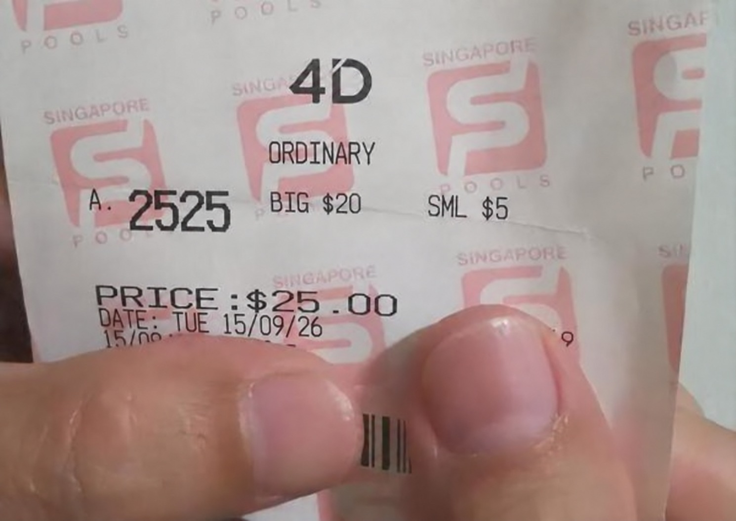 A pink 4D ticket with the combination 2525.