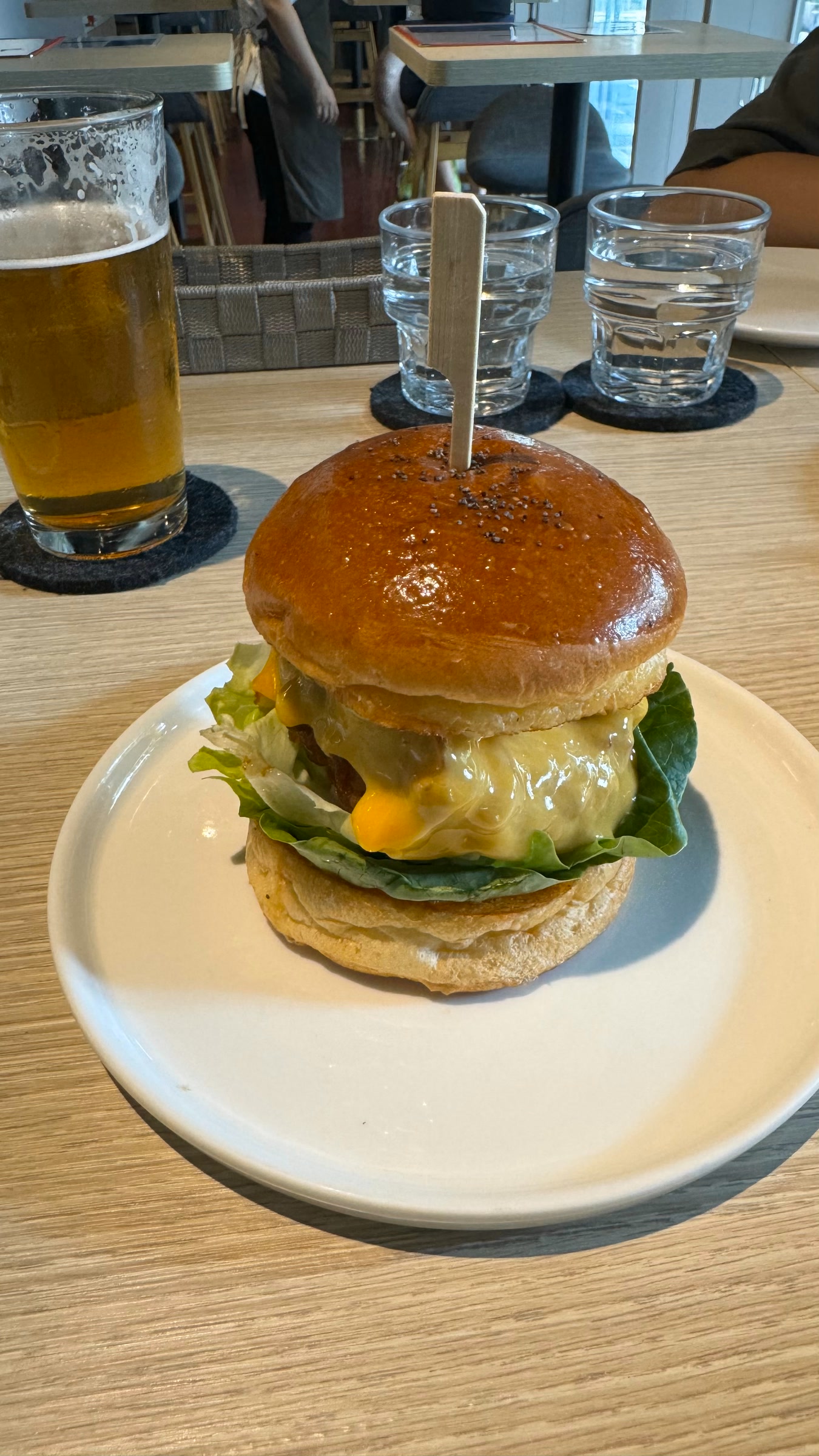 Cheeseburger at Wildfire with melted cheese on a brioche bun