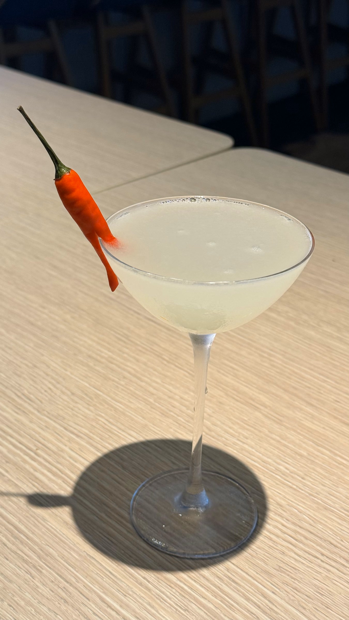 Pale cocktail garnished with a red chilli at Wildfire