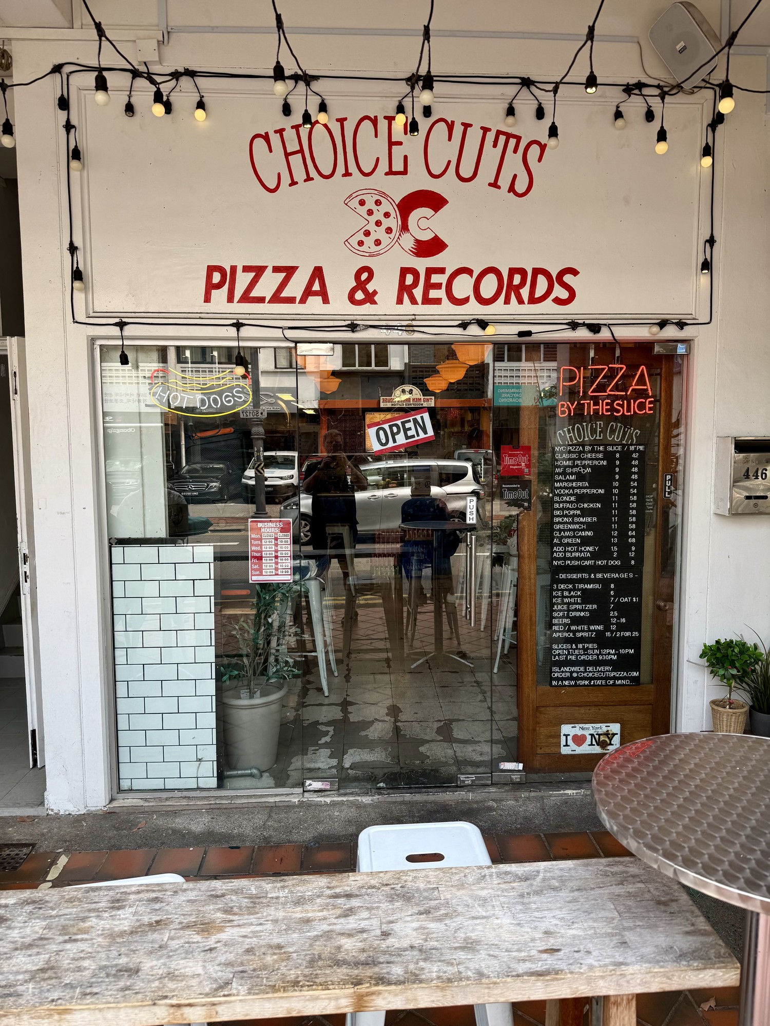 Choice Cuts Pizza & Records storefront on Joo Chiat Road with a Pizza by the Slice neon sign