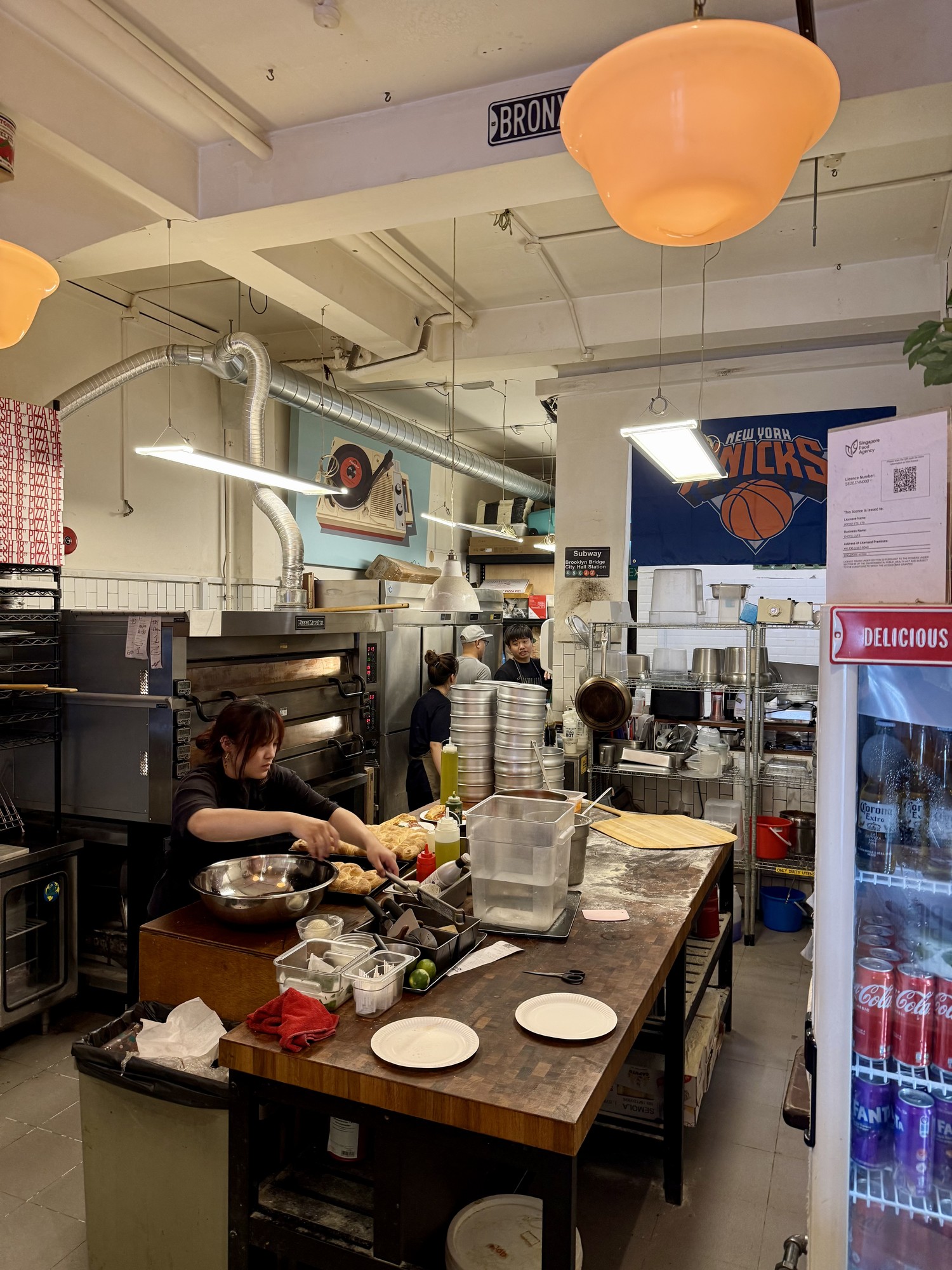 Open kitchen and pizza oven behind the counter at Choice Cuts