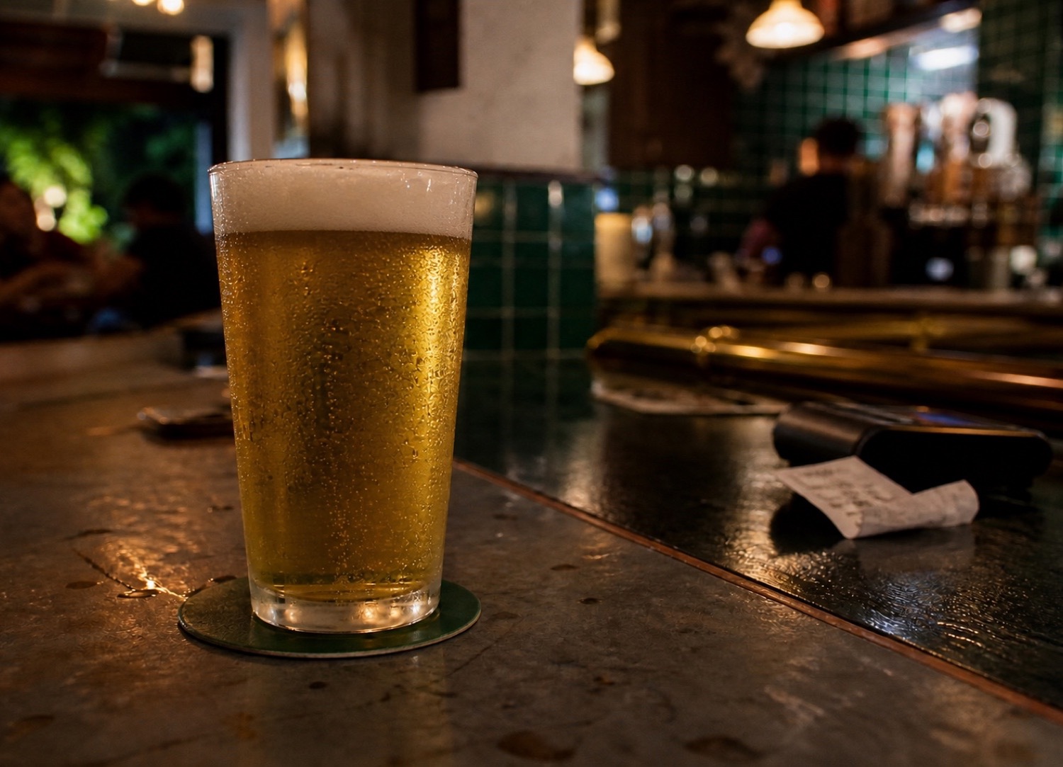 Fresh full pint of beer on a Singapore bar counter