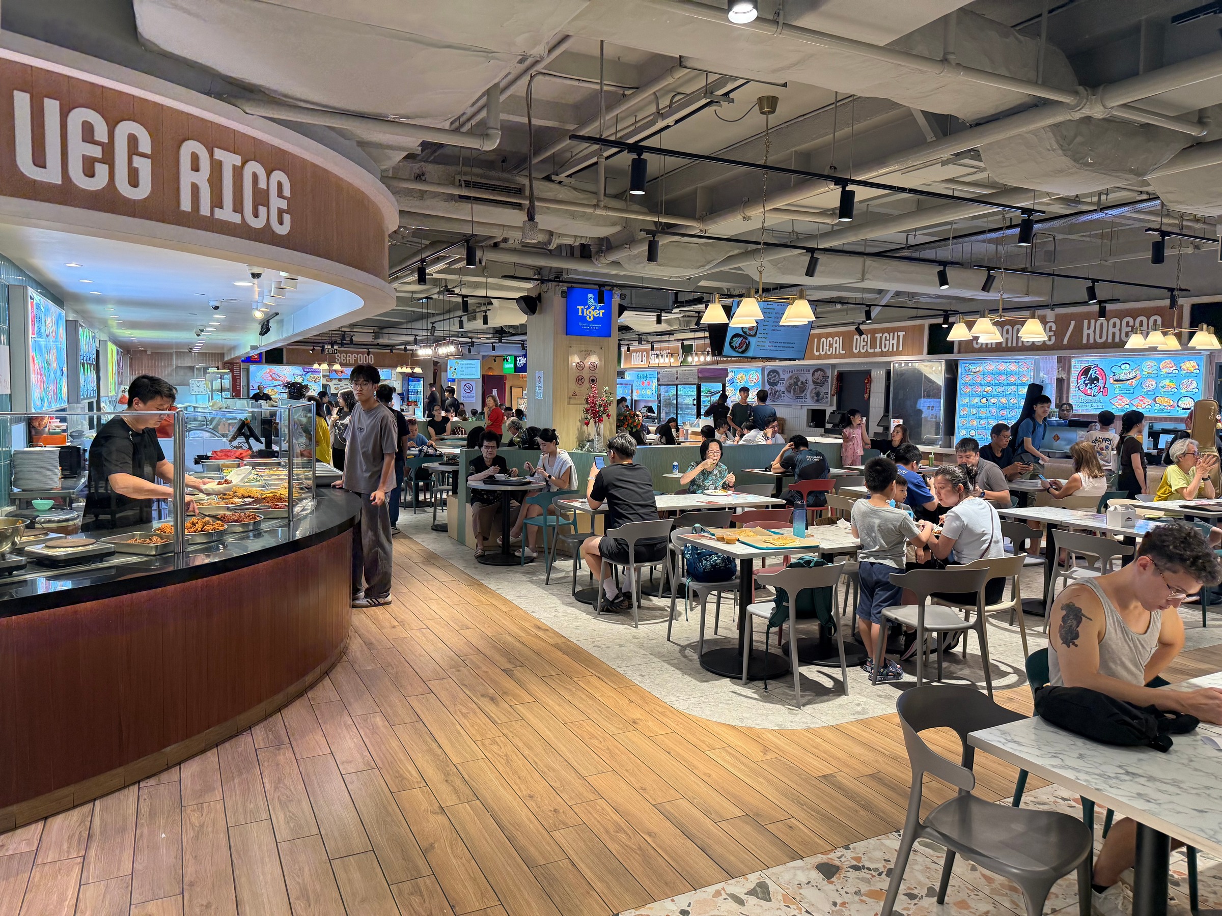 Tables and food counters in the newer food court at Katong Shopping Centre.