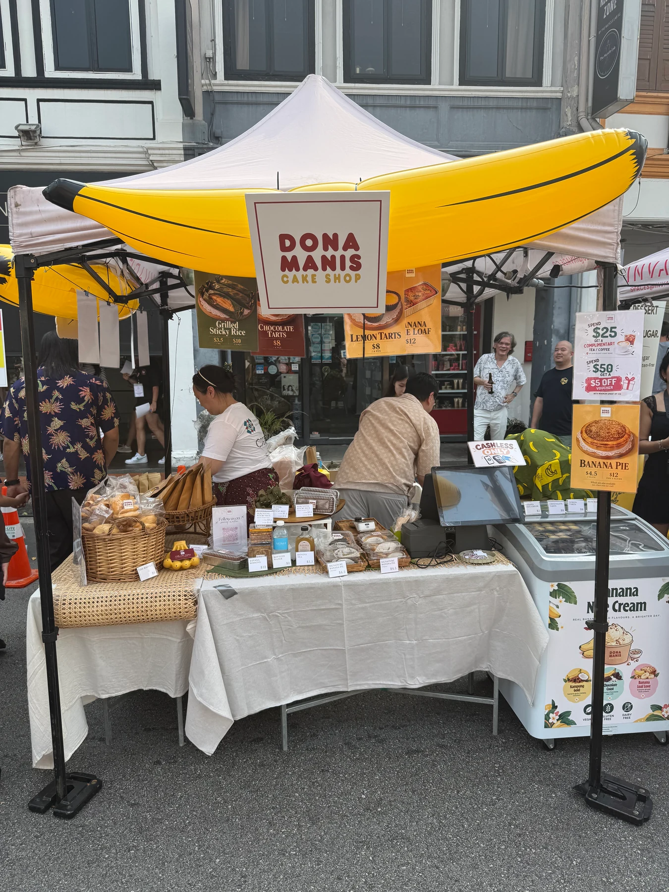 The Dona Manis stall beneath a giant yellow inflatable banana.